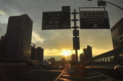 Road in city at sunset
