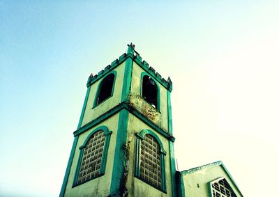 Low angle view of building against clear blue sky