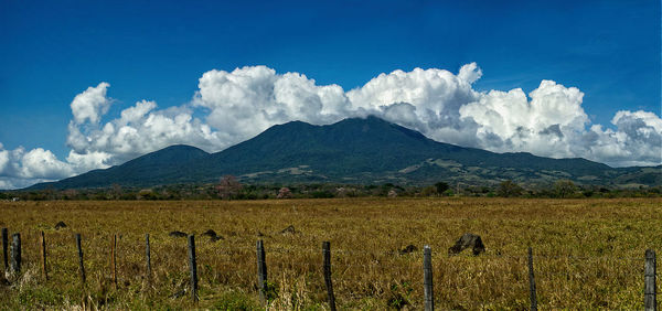 Scenic mountain against cloudy sky