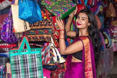 Portrait of a smiling young woman in market