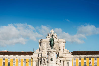 Low angle view of statue against cloudy sky