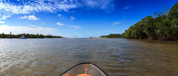 Scenic view of river against blue sky