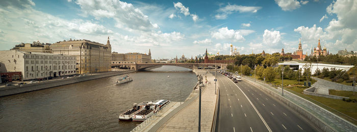 High angle view of bridge over river in city against sky.