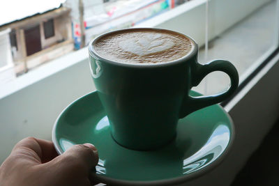 Close-up of coffee cup on table