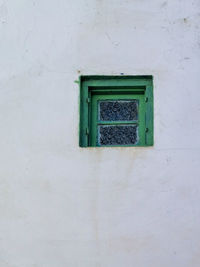 Green wooden window in the old medina of asilah