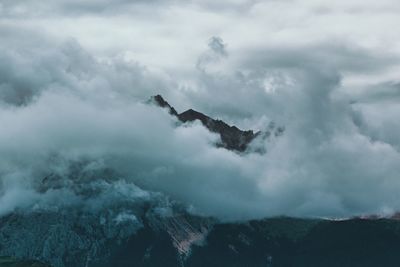 Scenic view of clouds over mountain against sky