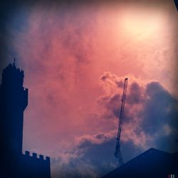 Low angle view of building against cloudy sky