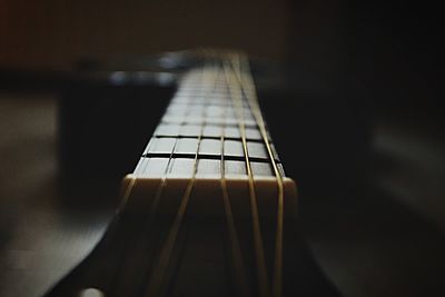 Close-up of guitar in darkroom