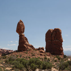 Low angle view of rock formation against sky