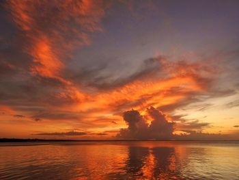 Scenic view of sea against orange sky