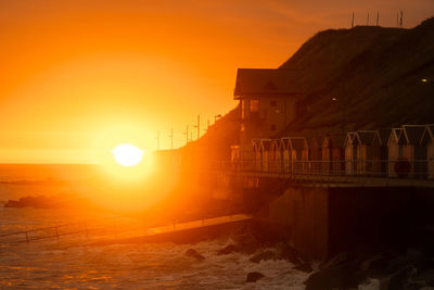 Sunrise over a seaside promenade