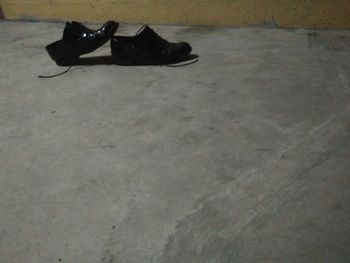 High angle view of black shoes on floor