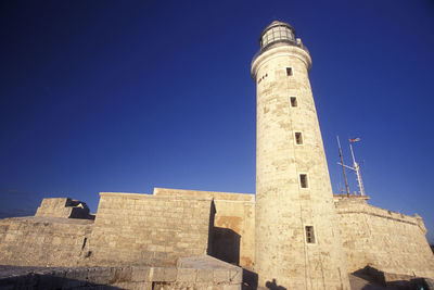 Low angle view of historic building against blue sky