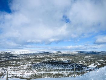 Scenic view of snow covered mountains against sky