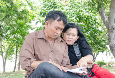 Couple sitting at park