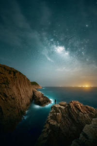 Scenic view of sea against sky at night