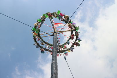 Low angle view of amusement park ride against sky