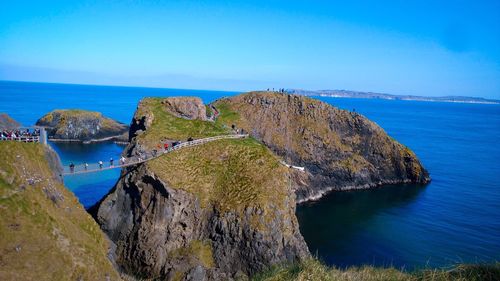 Scenic view of sea against clear blue sky