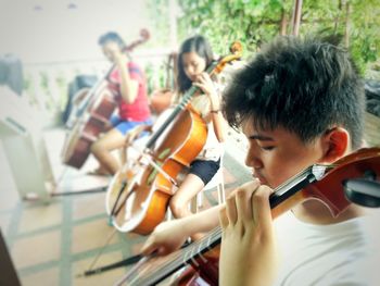 Teenagers playing violins
