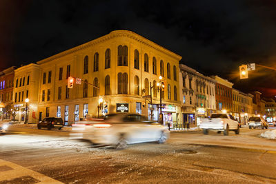 Buildings in city at night