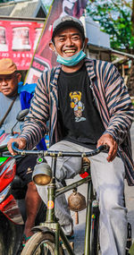 Portrait of woman riding bicycles on street