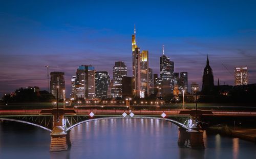 Illuminated city at waterfront