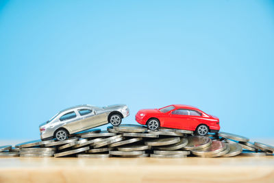 Close-up of toy car against blue sky