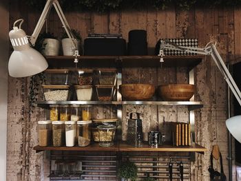 Electric lamp by shelves in kitchen