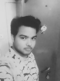 Portrait of young woman at home