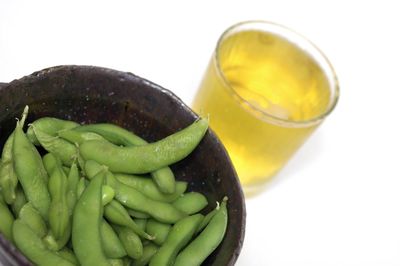 Close-up of green beans against white background