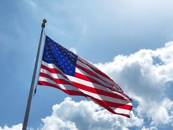 Low angle view of usa flag against sky