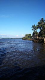 Scenic view of sea against clear blue sky