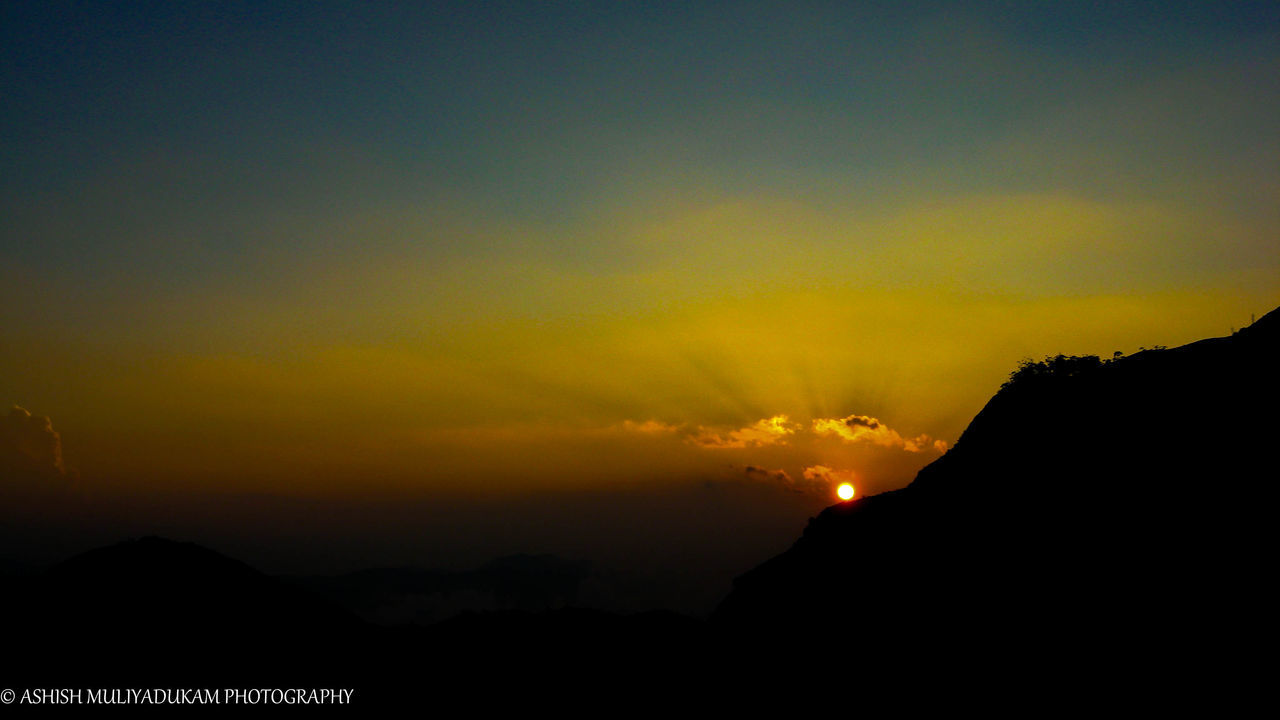 sunset, silhouette, scenics, beauty in nature, tranquil scene, mountain, tranquility, sky, orange color, idyllic, nature, copy space, mountain range, landscape, dusk, majestic, cloud - sky, outdoors, dark, dramatic sky