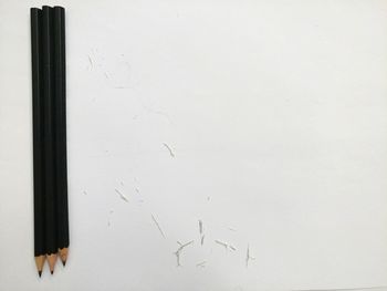 High angle view of pencils on white background