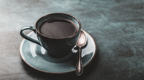 High angle view of coffee cup on table