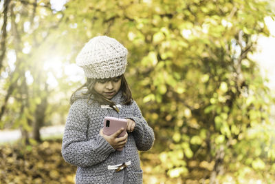 Young woman using mobile phone