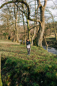 Full length of man walking in forest