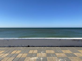 Scenic view of sea against clear blue sky