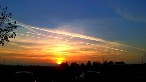 Scenic view of landscape against sky at sunset