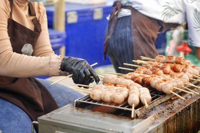 Midsection of man preparing food