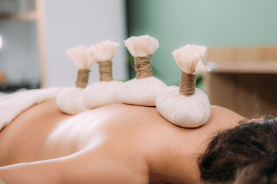 Ayurveda kizhi massage with herbal bolus bags