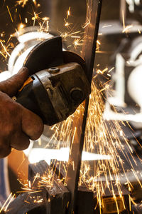 Man working on metal structure in factory