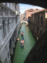 High angle view of people on boat in canal