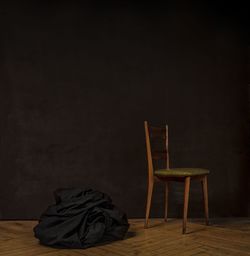 Empty chair and bean bag in dark room