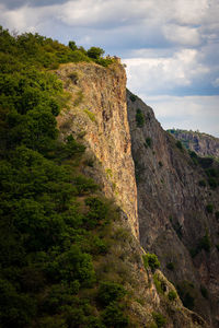 Low angle view of rocks against sky