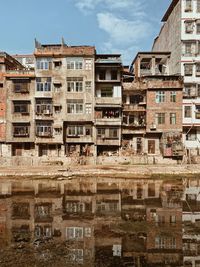 Buildings in city against sky