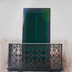 Close-up of closed window on wall of building