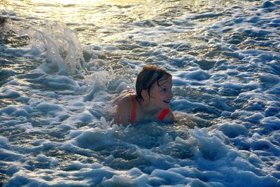 High angle view of girl in sea