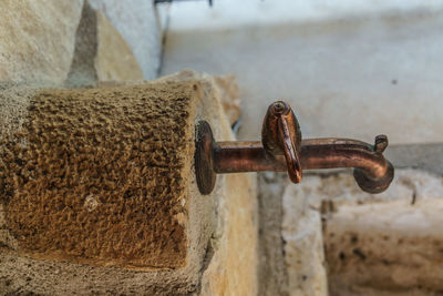 Close-up of rusty chain on wall