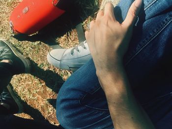 Low section of man sitting on floor